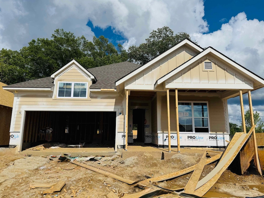 Property in mid-construction with roof with shingl