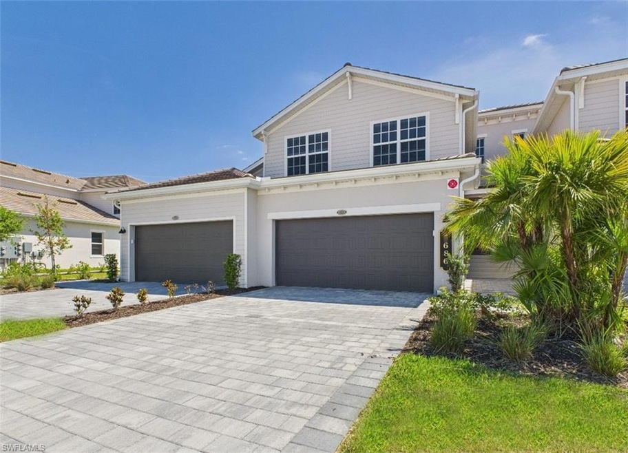 View of front facade with decorative driveway and 