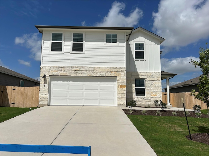 View of front of property featuring stone siding,