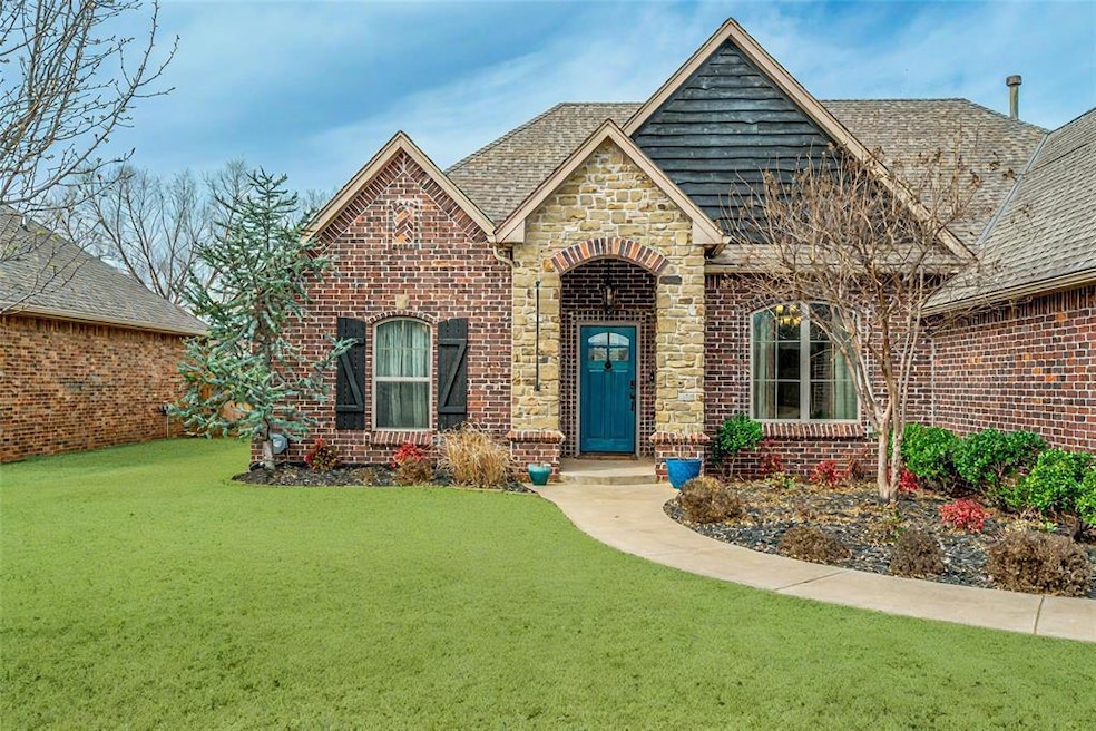 View of front of house featuring a shingled roof, 
