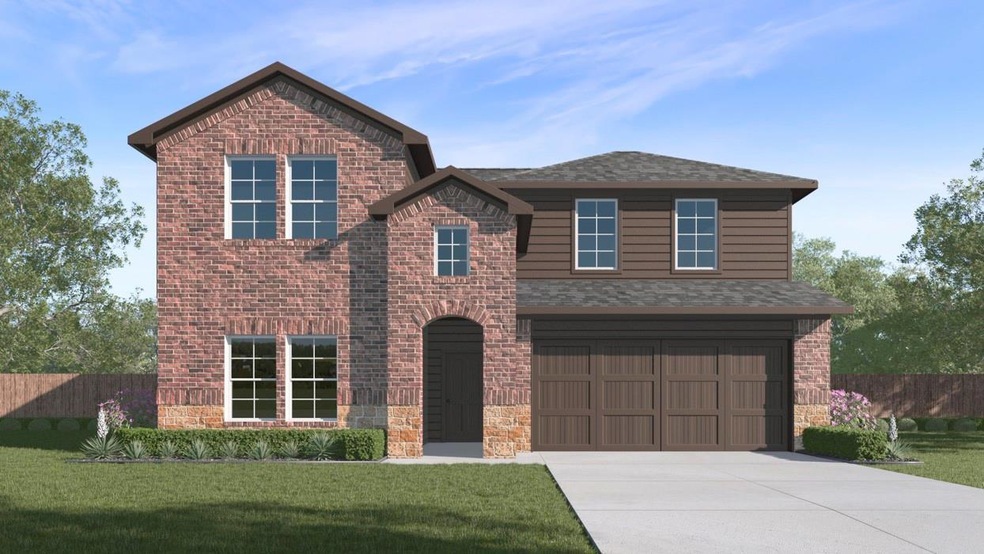 Traditional home with brick siding, driveway, a fr