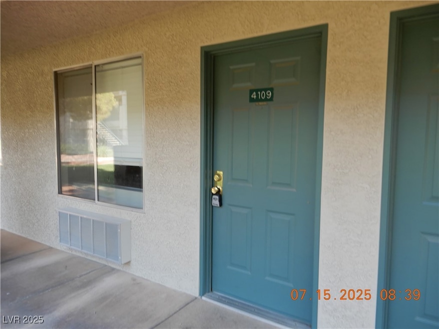 Doorway to property with stucco siding