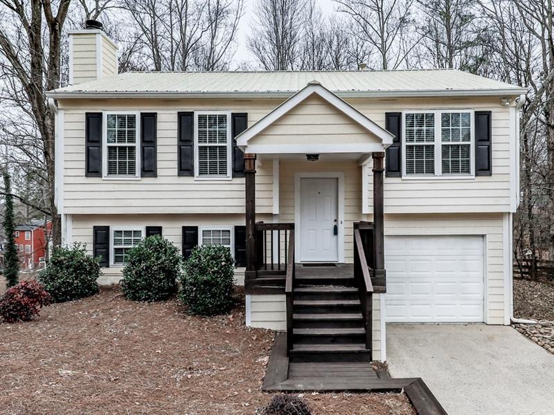 Cute house with a cozy front porch.