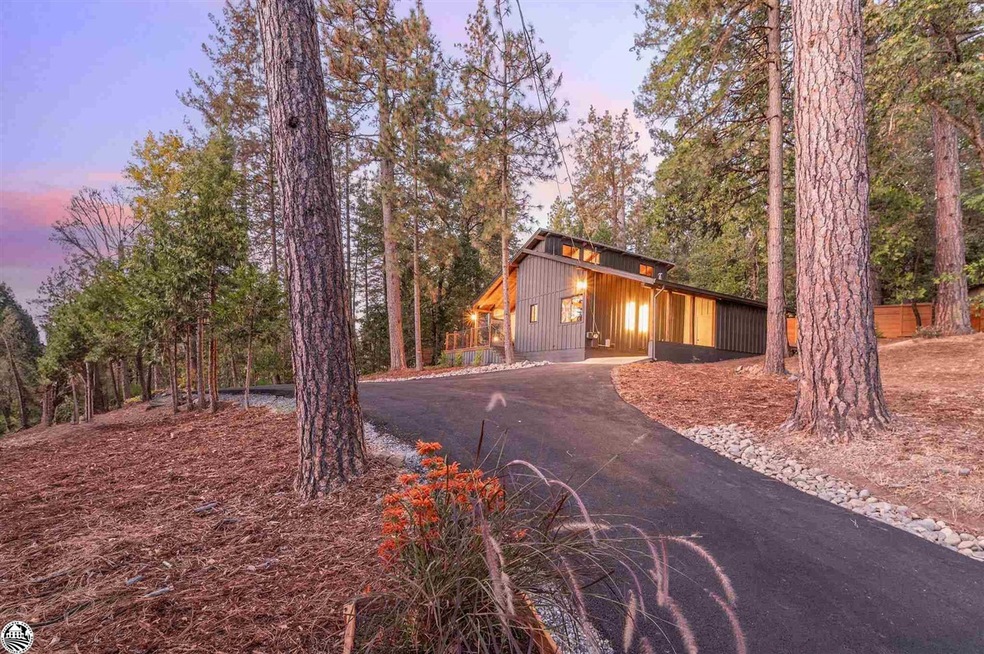 Property exterior at dusk with an outbuilding