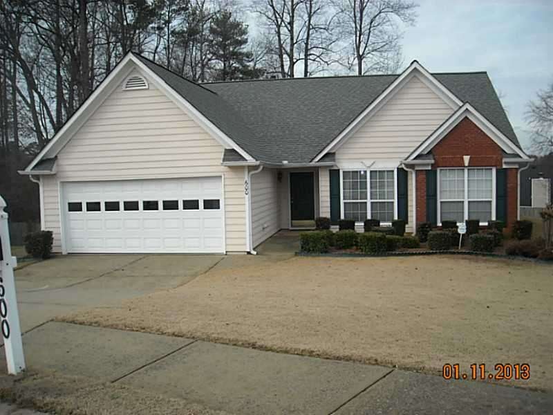 Exterior Front. Level Yard and Driveway,  Sidewalk