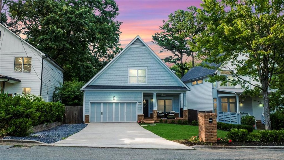 View of front of house featuring a garage and a co