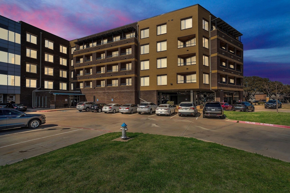 Property at dusk with uncovered parking