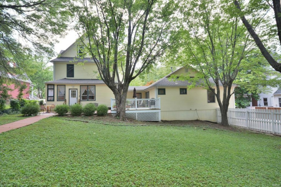 this is the back of the house.... too many trees blocking the front view but you can see the additional structure attached to the house!
