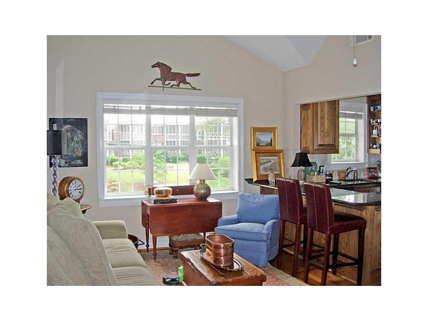 Living Room. Top Floor unit with 17 foot ceiling. 