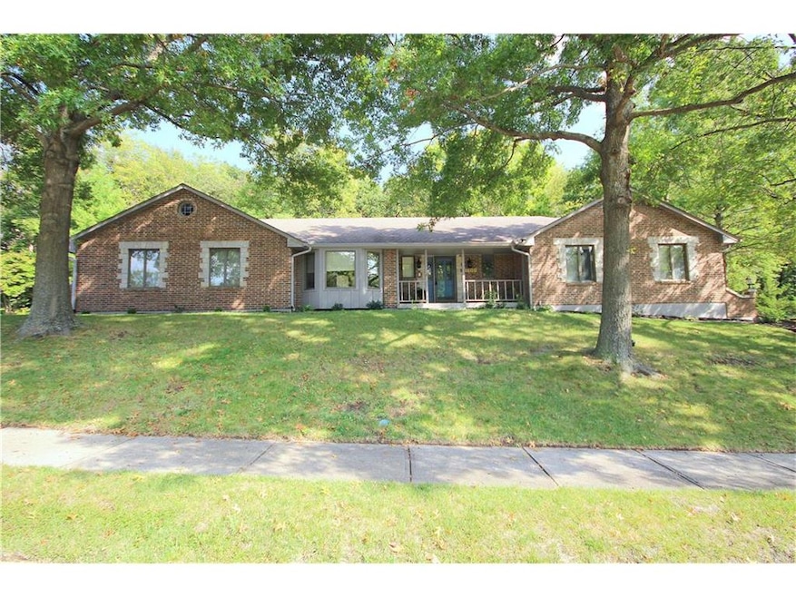 Sprawling ranch on large estate lot with mature tr