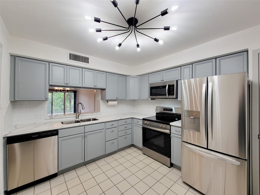 Renovated kitchen with stainless steel appliances