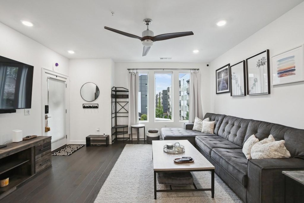 Living room with ceiling fan, recessed lighting, dark wood finished floors, and baseboards