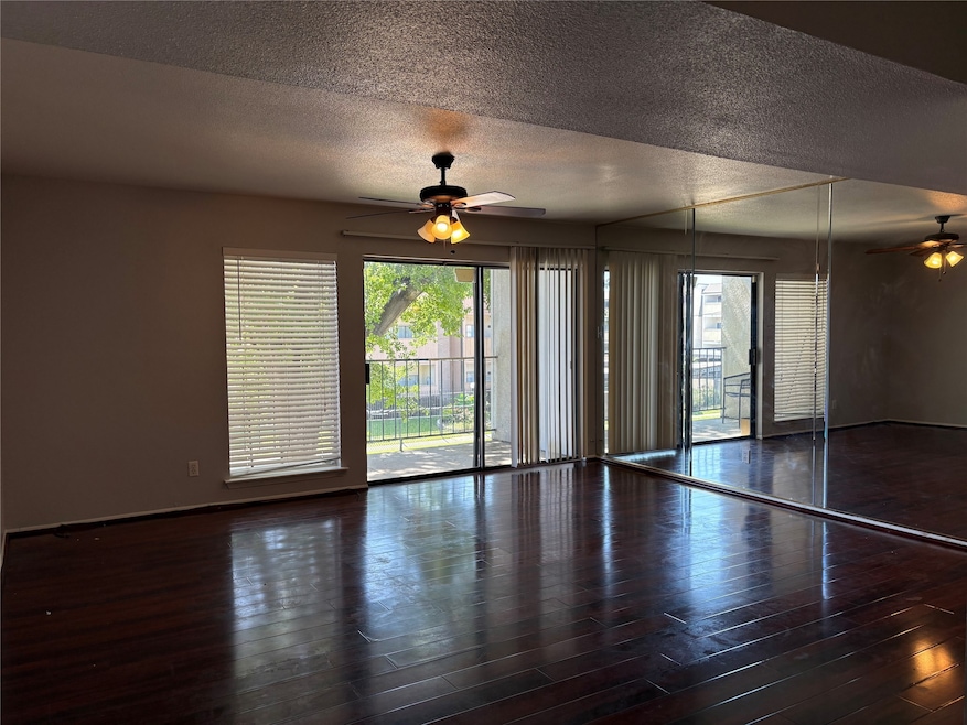 View of the Living Room with Balcony Access.