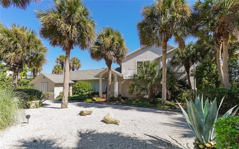 Front of home with circular drive. 
