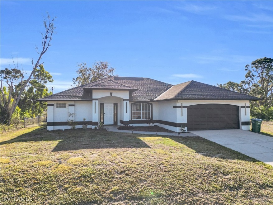 View of front of home featuring stucco siding, fen