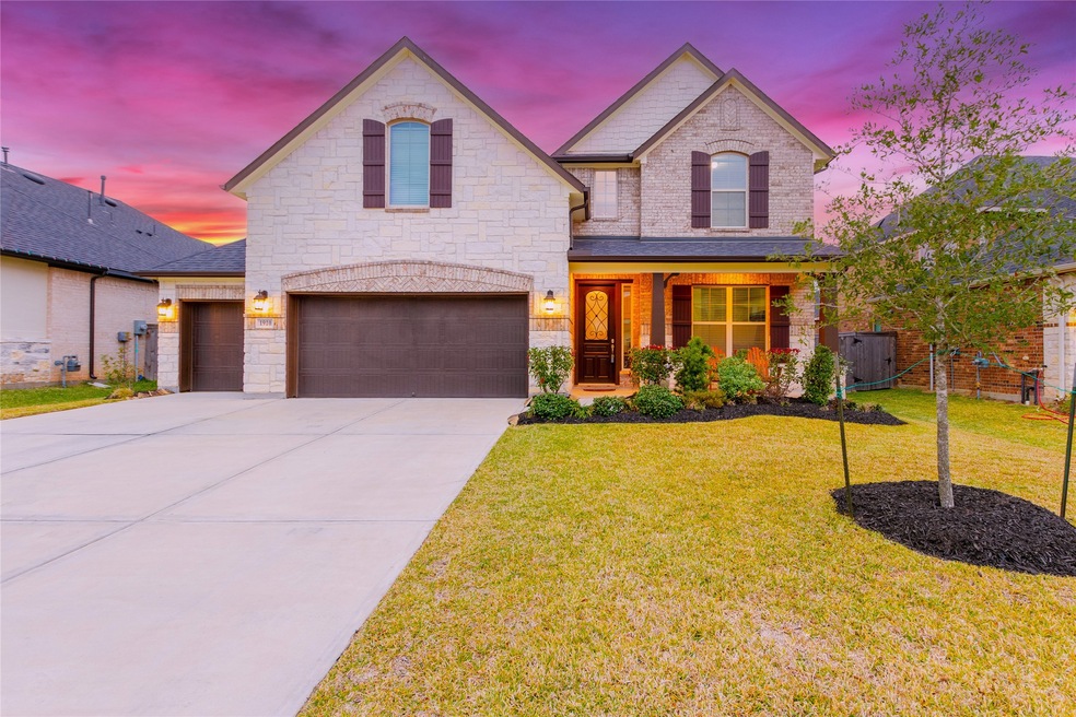 Welcome home to 1910 Evergreen Bay located in the community of Young Ranch and zoned to Katy ISD. This stunning home has lovely curb appeal, a well-manicured lawn, stone/brick elevation, dark stained front door with glass detailing, covered front porch, dark stained shutters, beautiful outdoor lanterns, and an extended driveway.