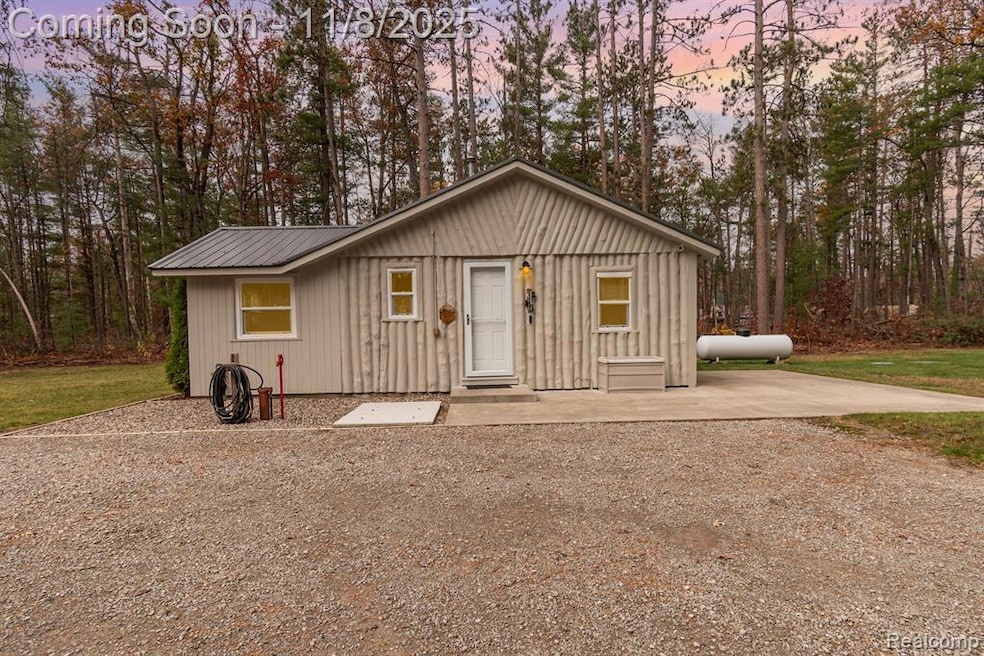 View of front of home featuring a metal roof