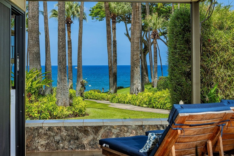 Unit 1101 affords a truly mesmerizing ocean view through the Fan Palm Grove & the lush grounds