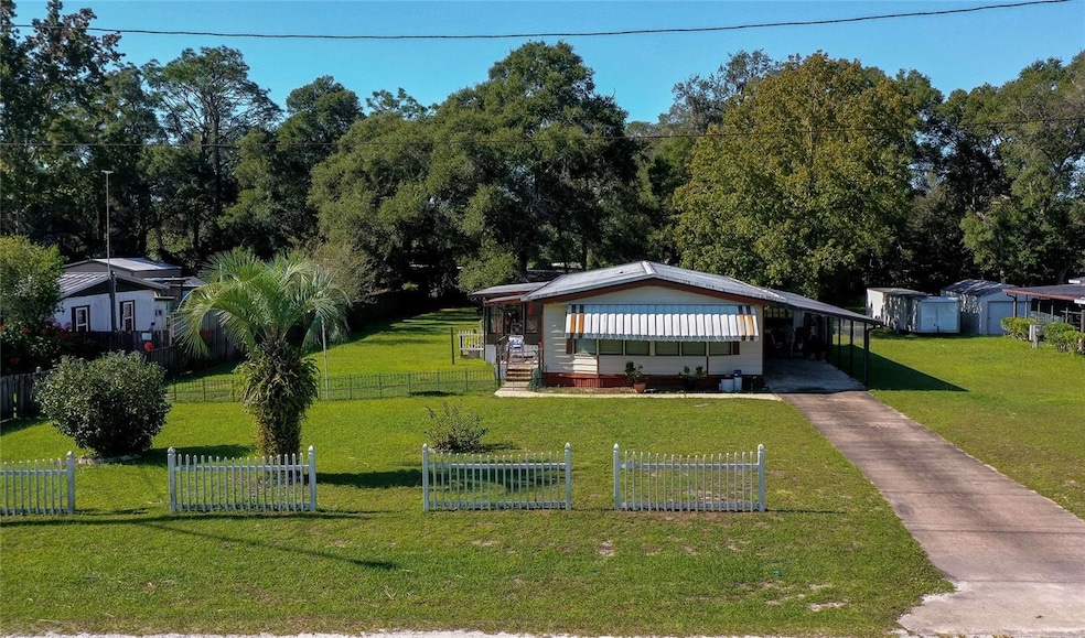 Set on a spacious lot with mature trees and a charming picket fence, this home offers an extended driveway, and ample green space for outdoor enjoyment.