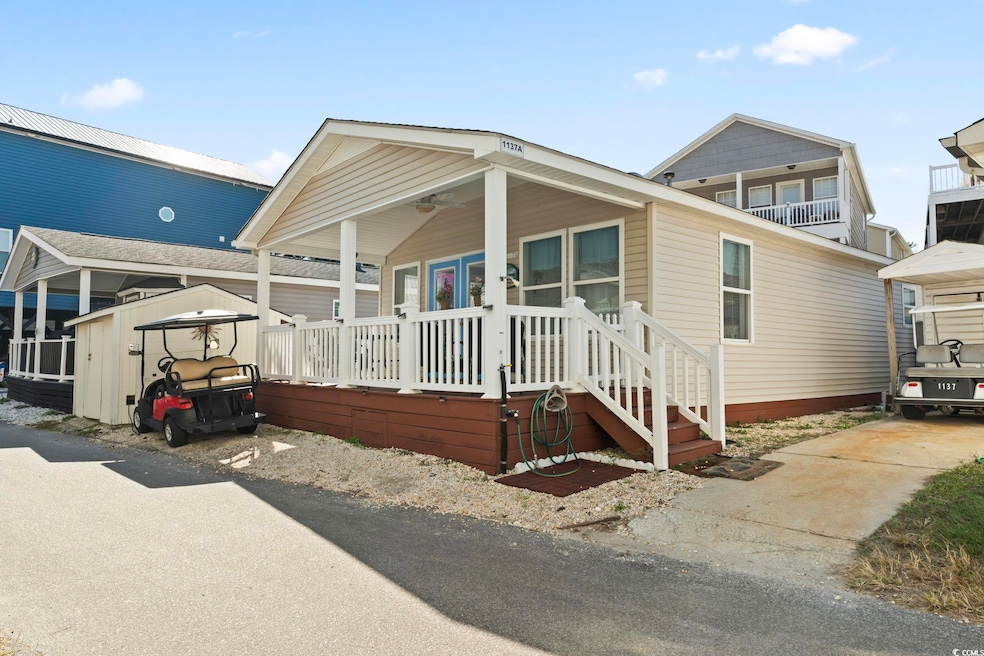 View of front of home with a storage shed and a po