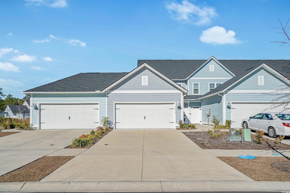 View of front facade featuring a garage