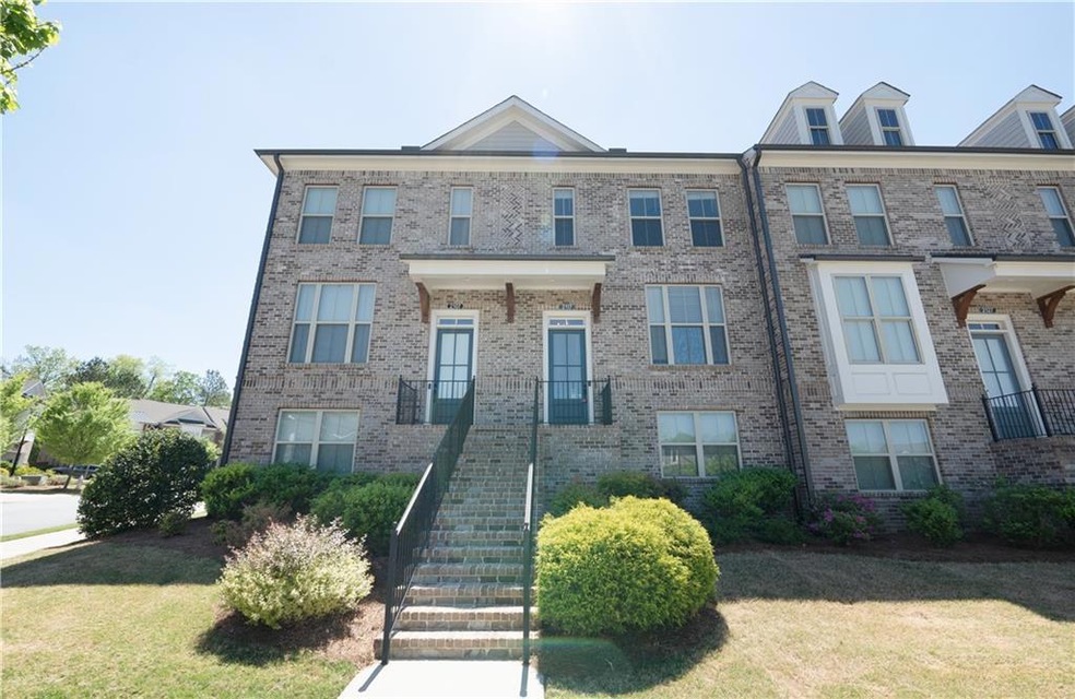 Townhome / multi-family property featuring a front