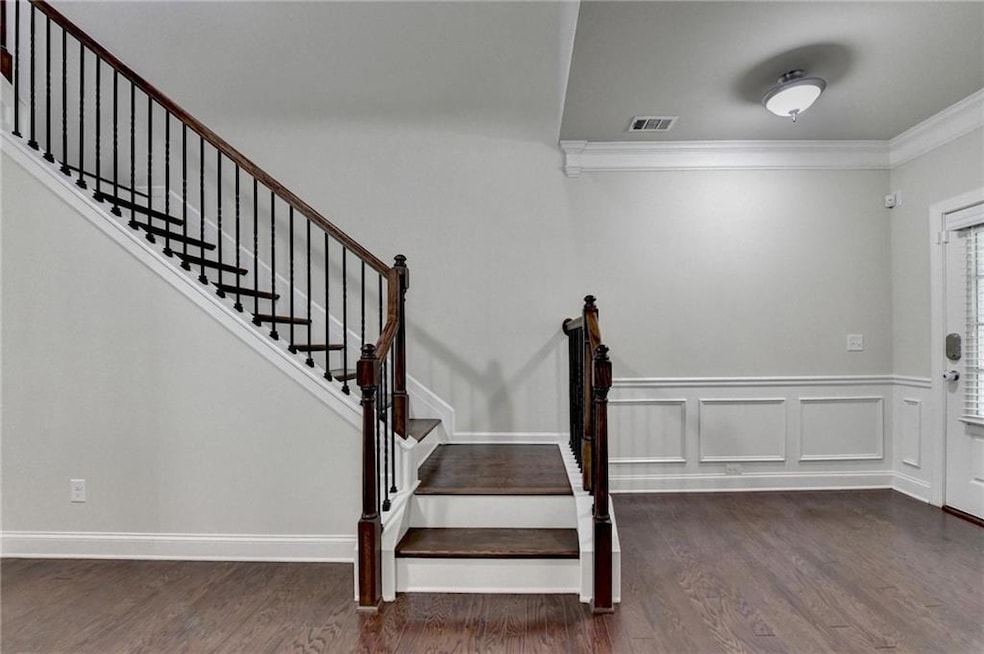 Stairway with ornamental molding and wood finished