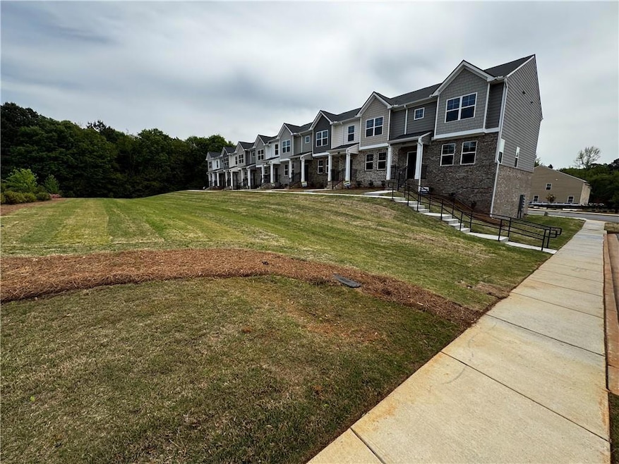 View of property's community with a yard
