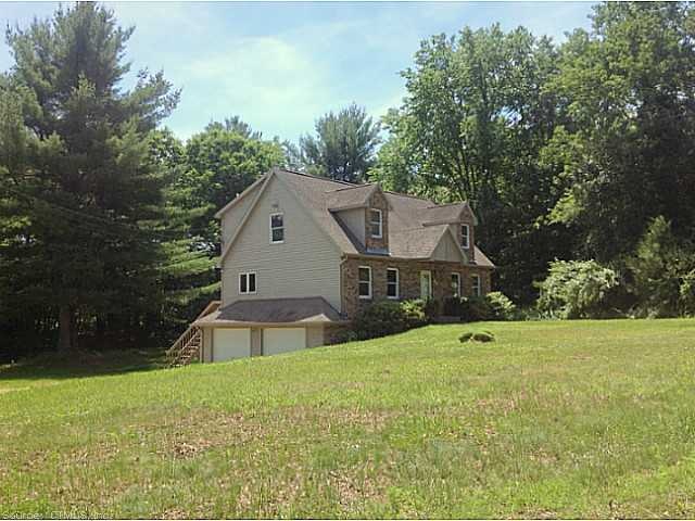 Exterior Front. Private setting on a non-thru stre