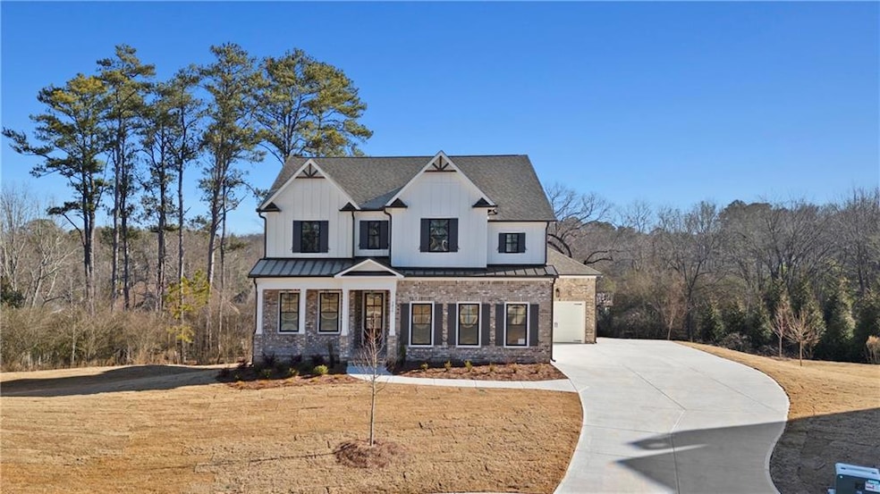 Modern inspired home featuring driveway, a garage,