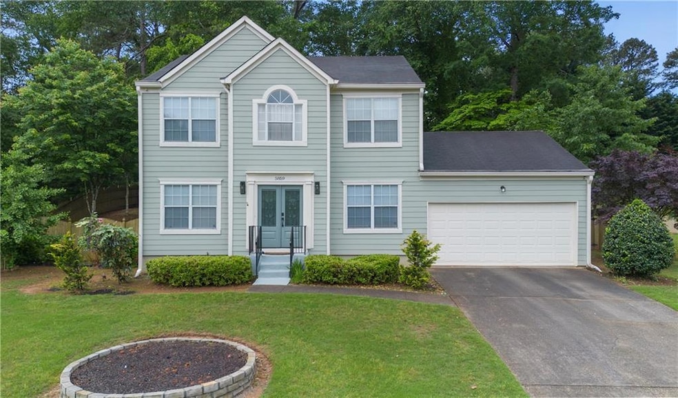 View of front of house featuring french doors, asp
