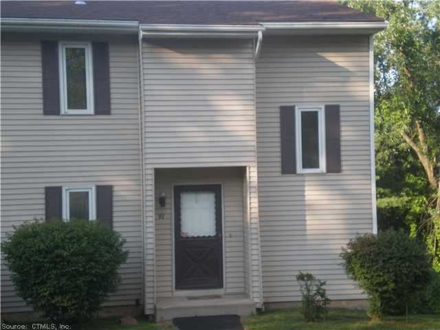 Exterior Front. End unit with ample privacy and gr