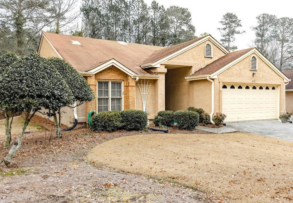 Ranch-style house featuring a garage