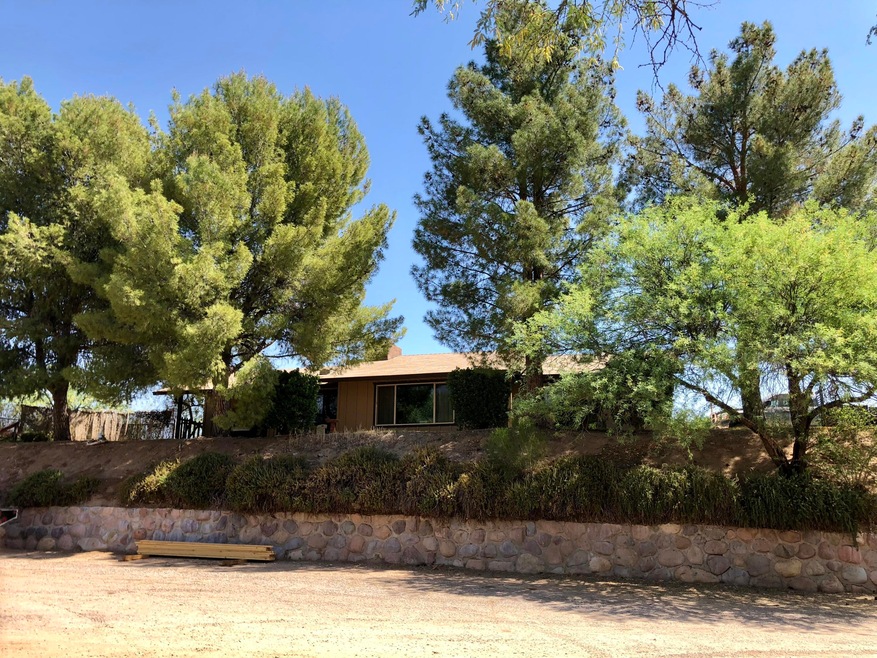 Home sits on hill with Mtn Views