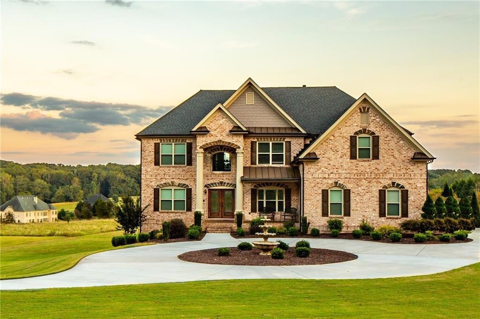 View of front of house with a yard, brick siding, 