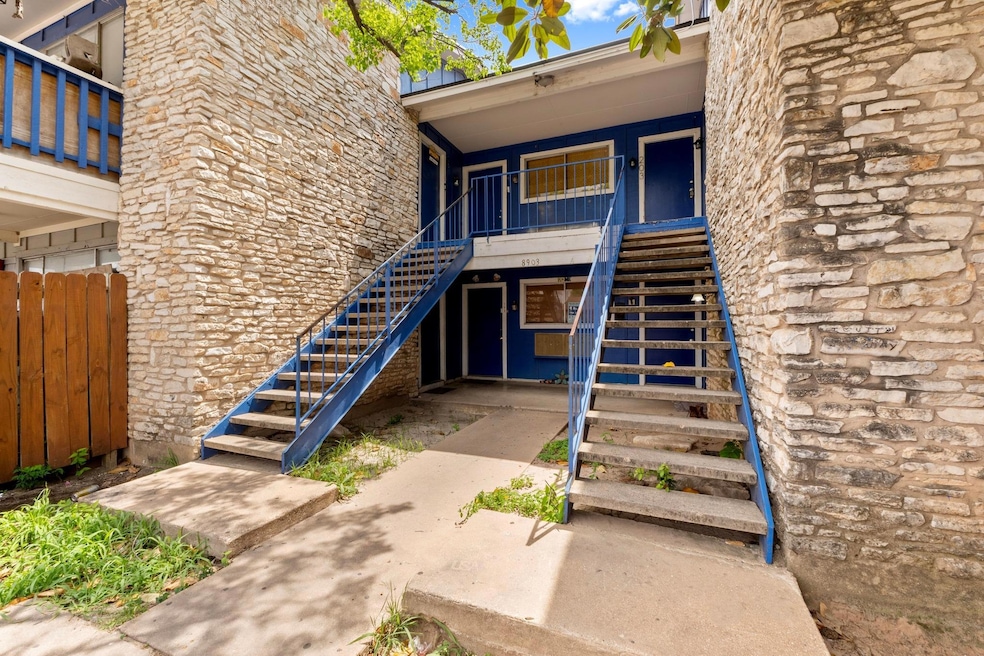 Entrance to property with a porch and fence