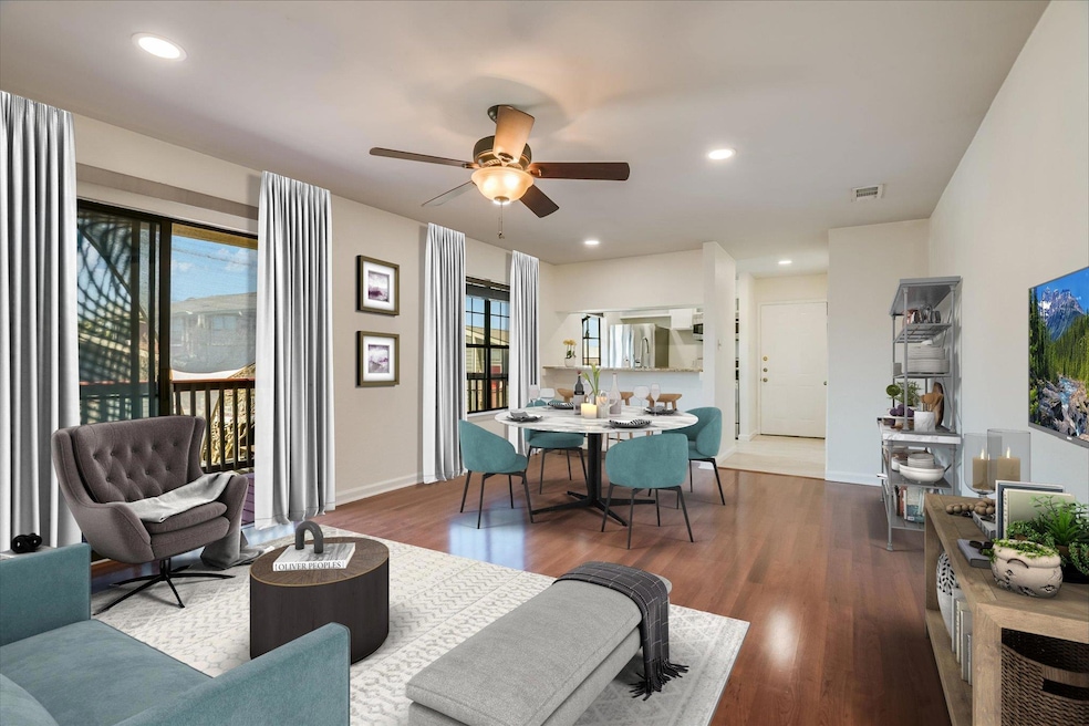 Living room with baseboards, wood finished floors