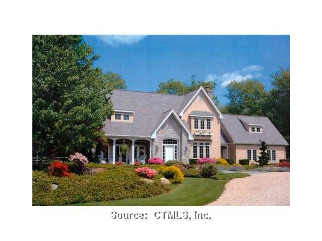 Exterior Front. English Stone Cape