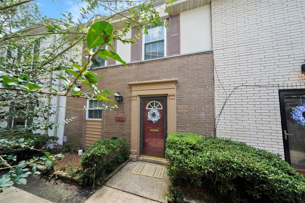 What a cute and inviting front door and elevation!