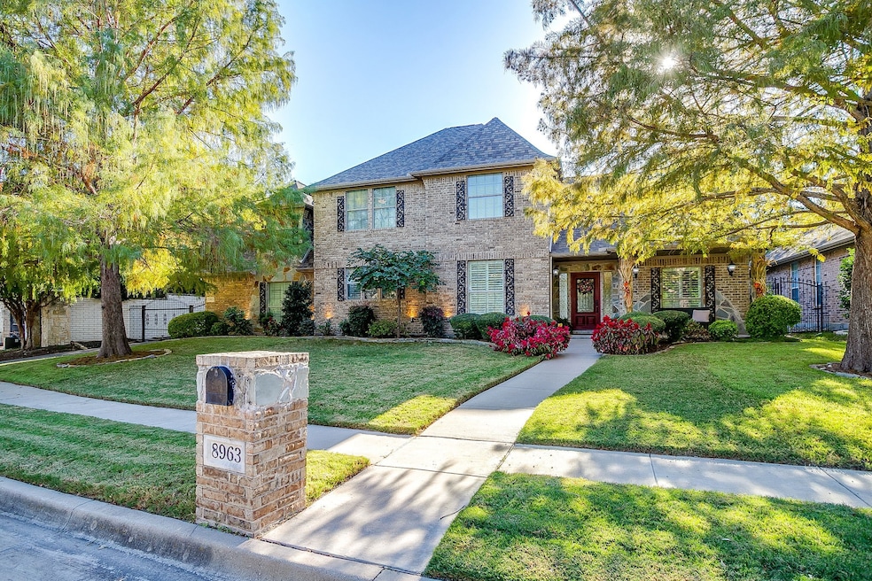 Colonial-style house with brick siding