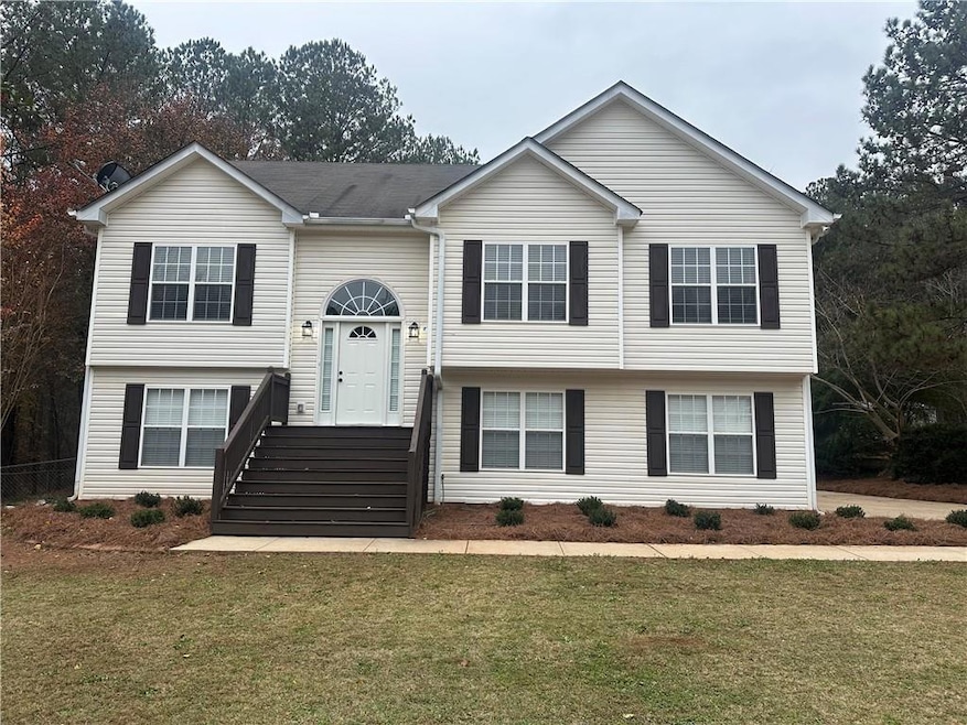 Split foyer home with a front yard