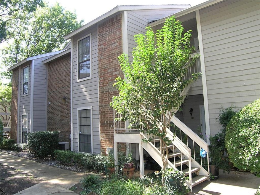 VIEW FROM PARKING AREA AND DRIVEWAY .  GO UPSTAIRS