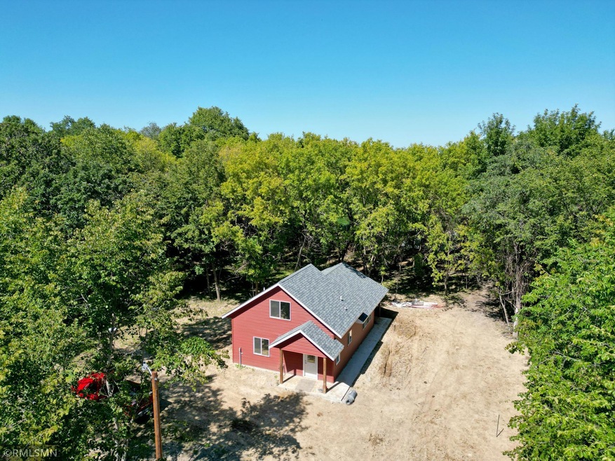 The home was completed in 2021 and is surrounded by woods offering fantastic privacy.