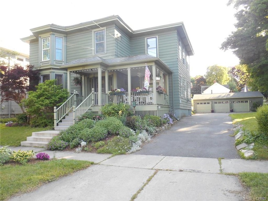 Beautiful perrenials wrap around this charming hou