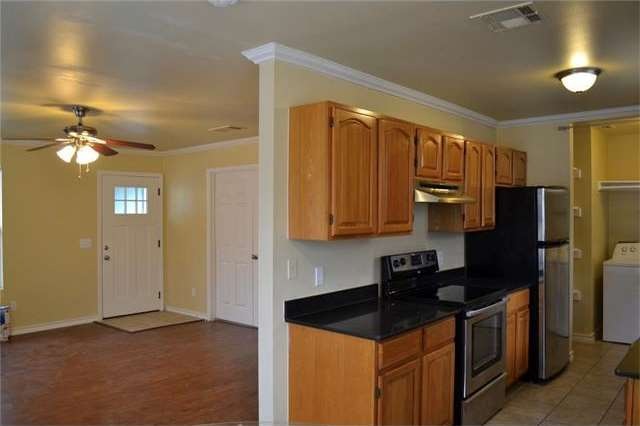 Black Quartz countertops, Stainless Steel applianc