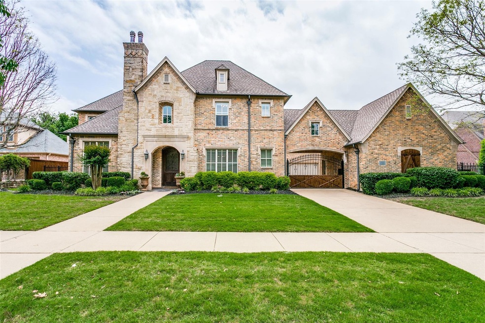 French provincial home featuring a front lawn