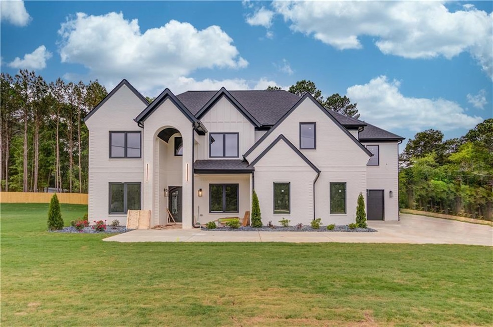 French country inspired facade featuring a front l