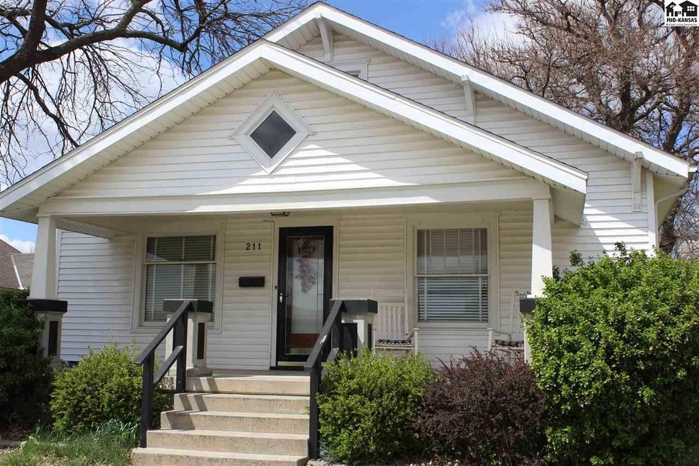 Large covered concrete front porch.