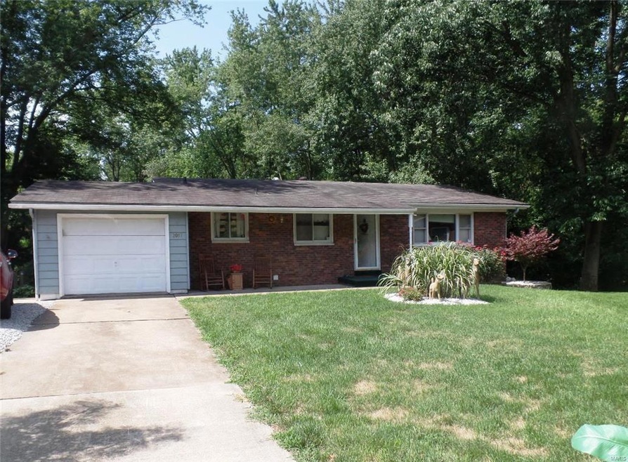 Front view with wooded backdrop