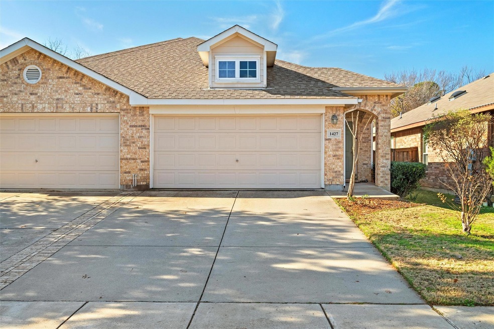 View of front of home featuring a garage